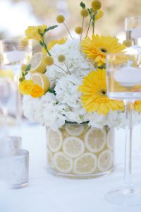 A floral arrangement with white and yellow flowers