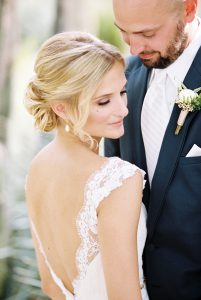 A blonde-haired bride with her groom