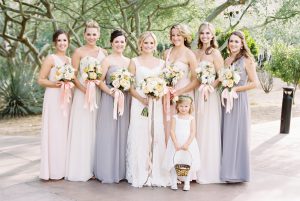 A bride with her bridesmaids and flower girl