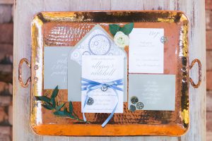 A tray with various wedding invitations