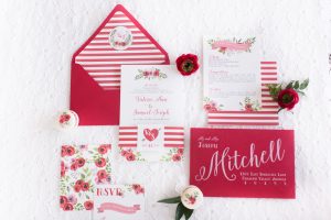 A red and white wedding invitation set