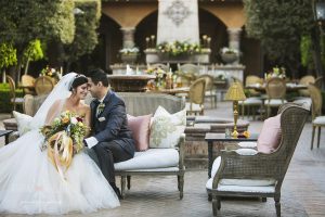 A bride and groom sitting down