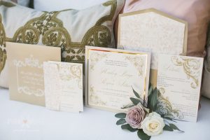 A set of wedding invites and pillows
