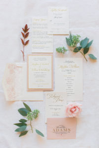 A set of wedding invites and branches