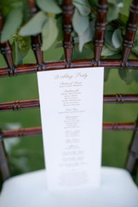 A wedding invitation on a chair