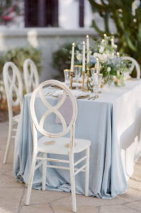 Table with stylish chairs and candles