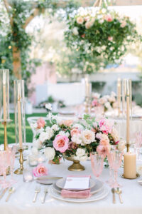 A table centerpiece with pink roses