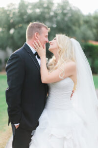 A bride and groom preparing to kiss each other